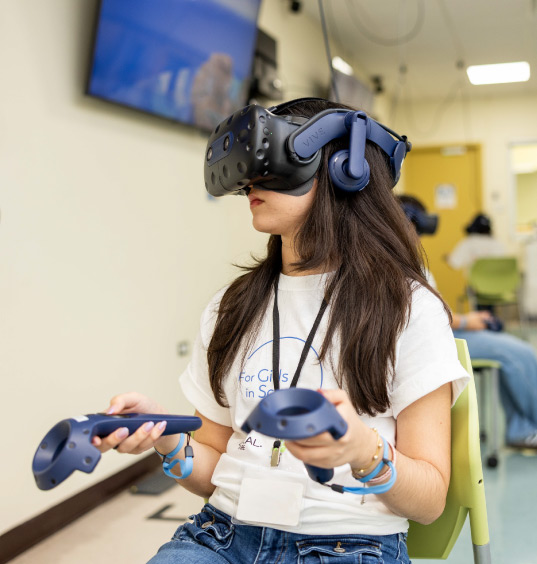 photo of a girl using a VR headset