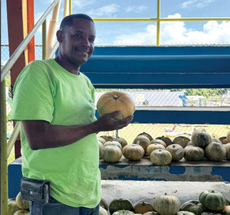 a photo of a man holding a pumpkin