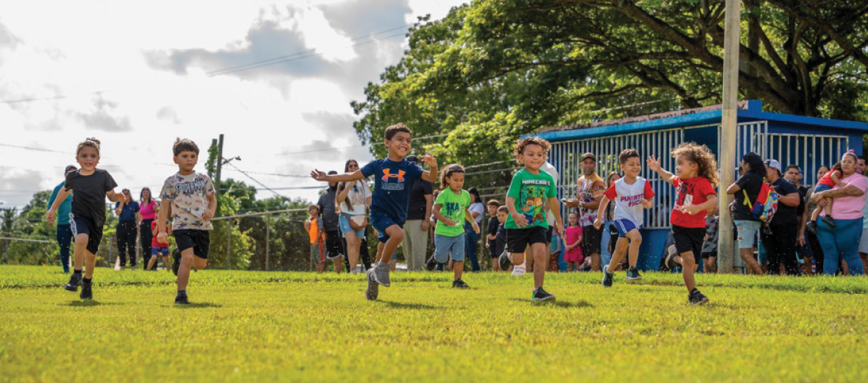 a photo of a group of children playing soccer