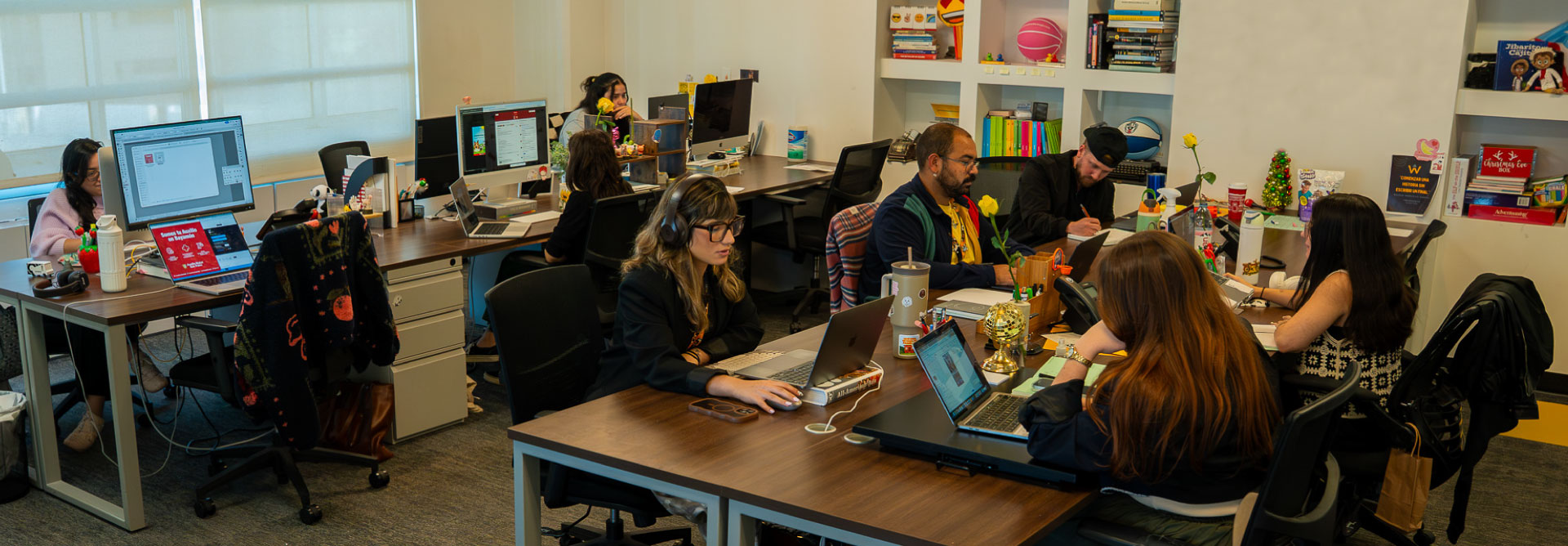 a photo of the agency's creative area with employees working
